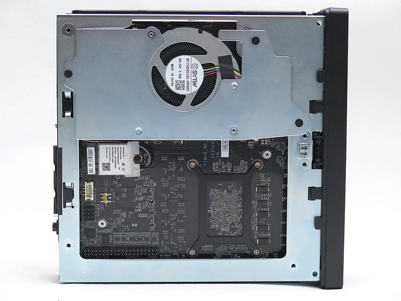 Internal view of Minisforum MS-R1 Mini PC showing motherboard and cooling fan assembly