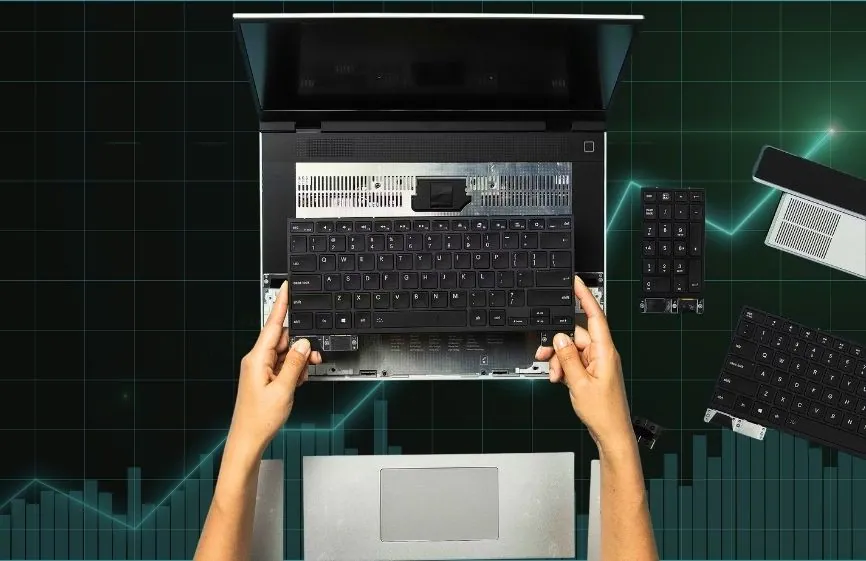 Framework Raises DDR5 Upgrade Prices by 50% as RAM Costs Surge 1 Laptop opened with keyboard removed, showing internal components during RAM or hardware upgrade process.