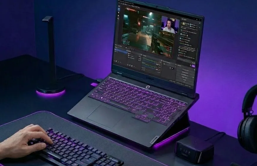 Best Laptop for Streaming in 2026 – Our Top Picks 30 Lenovo Legion Pro 7i laptop shown on a desk running live game streaming software with RGB keyboard and external peripherals