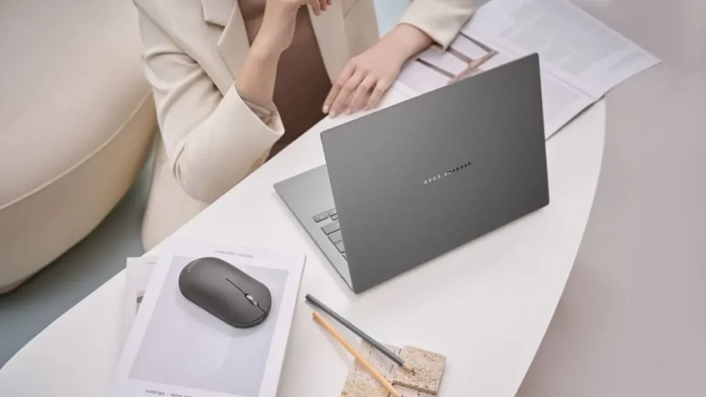 ASUS ZenMouse MD202 Wireless Mouse Announced With 7-Month Battery 1 ASUS ZenMouse MD202 used with laptop on desk in workspace