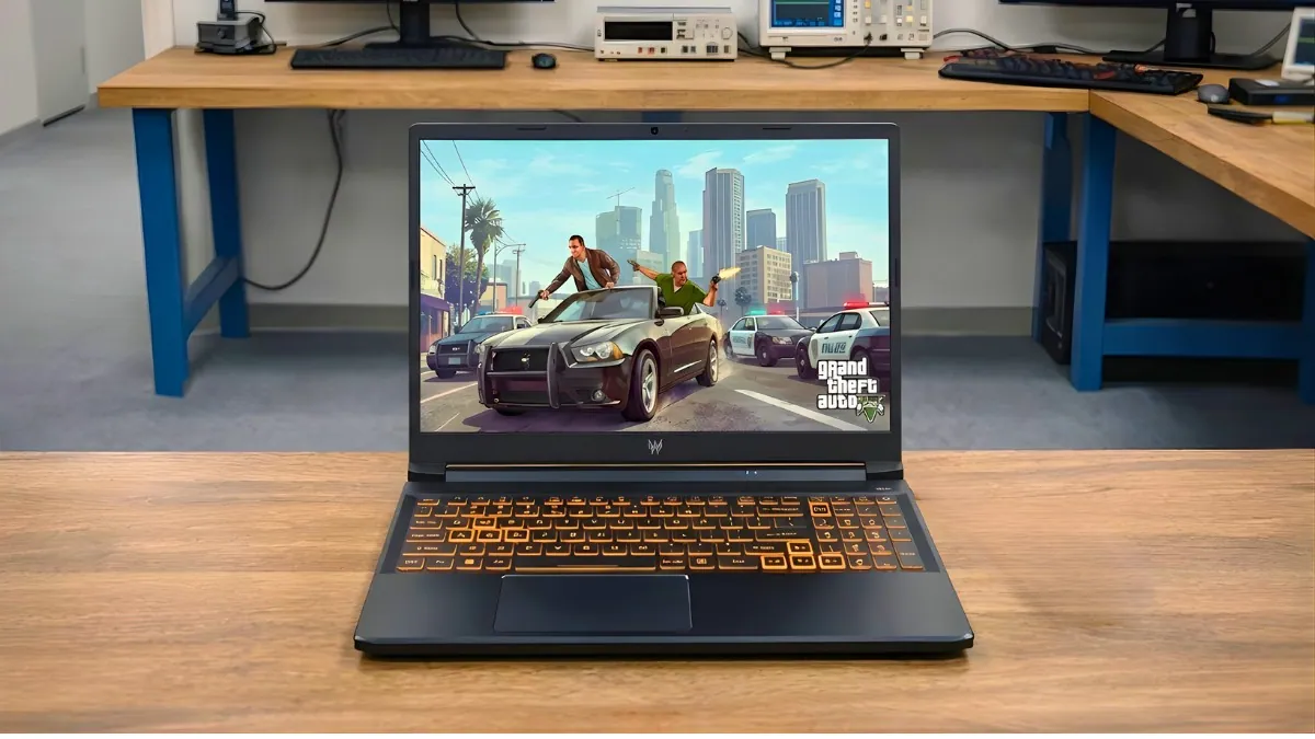 Acer Nitro V gaming laptop placed on our pcvenus desk with a game running on the display in a testing lab environment