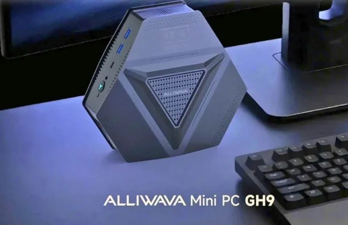 ALLIWAVA GH9 Mini PC placed on a desk beside a keyboard and monitor, showing its compact geometric design