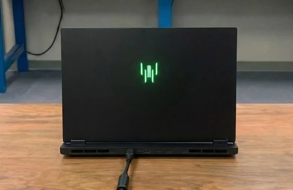 Rear view of Acer Predator Helios Neo 16S AI with lid closed showing illuminated Predator logo and rear vents