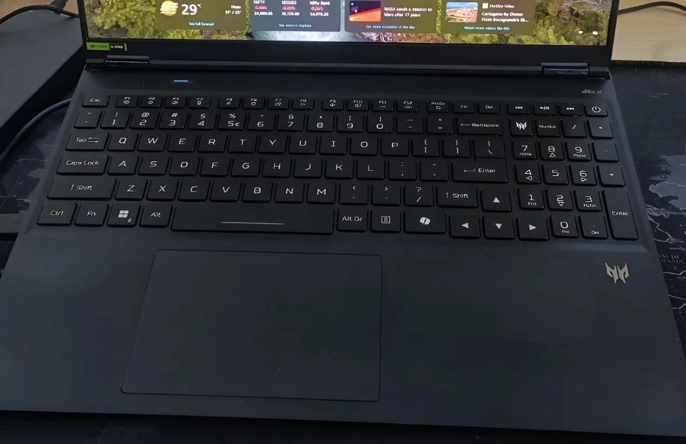 Close-up view of Acer Predator Helios Neo 16S AI keyboard, touchpad, and Predator branding