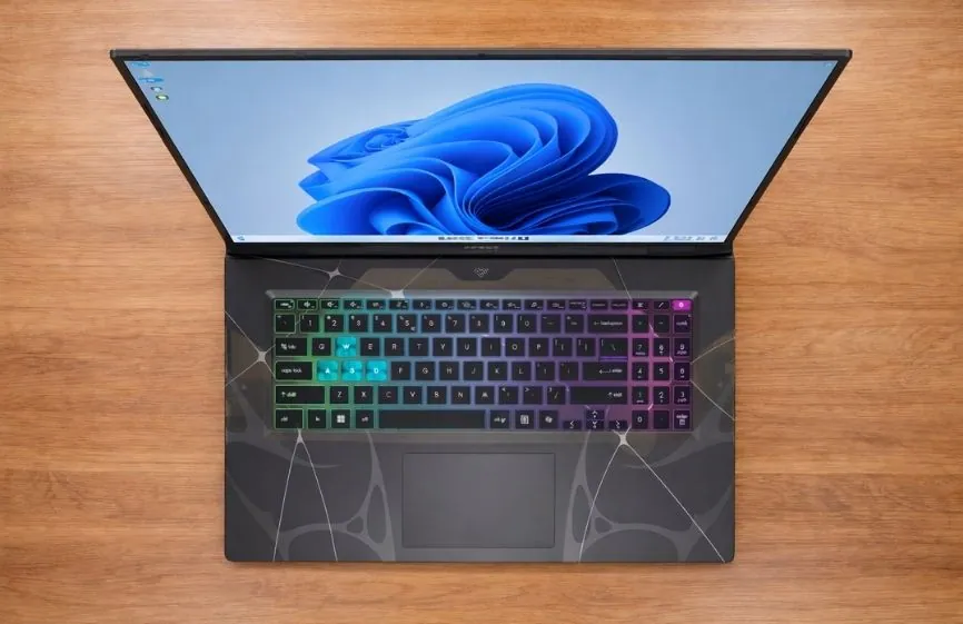 Top-down view of MSI Cyborg 17 showing full-size keyboard with RGB lighting and Windows desktop on screen
