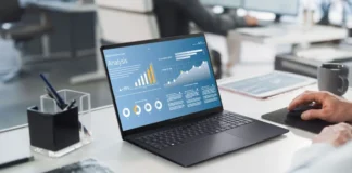 ASUS ExpertBook B5 G2 Arrives With 50 TOPS AI and 19-Hour Battery ASUS ExpertBook B5 G2 business laptop displaying analytics dashboard in office environment