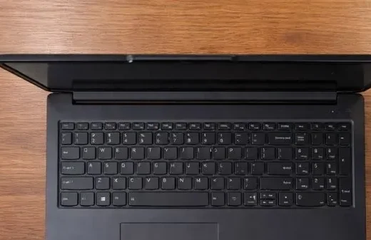 Top-down view of Lenovo LOQ 15 Essential showing the keyboard layout and large trackpad area