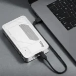 Tiiny AI Pocket Lab 160 TOPS mini PC connected to laptop via USB-C