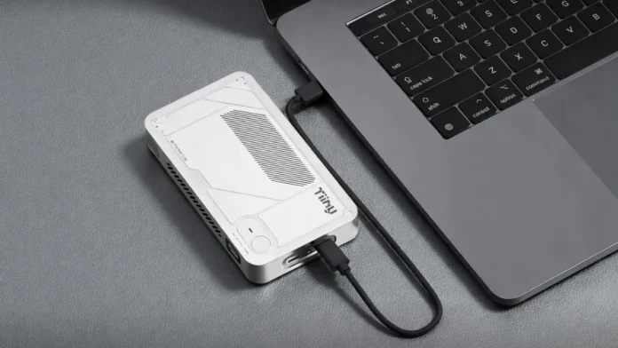 Tiiny AI Pocket Lab 160 TOPS Mini PC Tiiny AI Pocket Lab 160 TOPS mini PC connected to laptop via USB-C