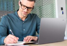 Acer TravelMate P2 & P4 Copilot+ PCs Launch With Intel Core Ultra Series 3 Acer TravelMate P4 14 AI business laptop used in an office workspace