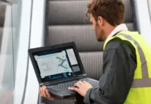 Panasonic Introduces TOUGHBOOK 56 Rugged Laptop With Triple LAN and Wi-Fi 7 Technician using Panasonic TOUGHBOOK 56 rugged laptop while standing in an industrial environment
