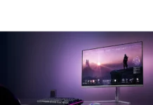 Philips Evnia 32M2N8900X 4K 240Hz OLED Monitor Listed Philips Evnia monitor on desk setup with keyboard and mouse in RGB lighting environment