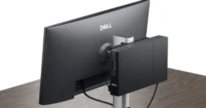 Dell Pro Micro Thin Client Q9M1260 mounted behind Dell monitor showing compact fanless design and cable-managed workspace setup