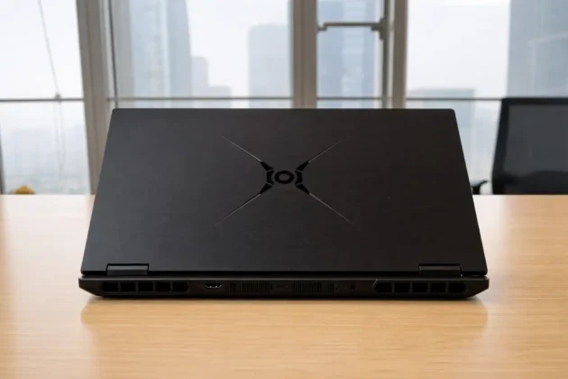 Honor WIN H7 Gaming Laptop closed on desk showing rear vents and minimalist lid design