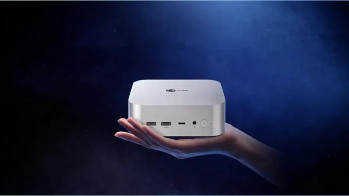 Lenovo Lecoo mini PC shown in hand demonstrating compact size