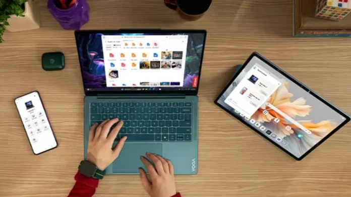 Lenovo Yoga Slim 7x 14 Gen 11 used with smartphone and tablet in connected workspace