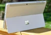 Microsoft Raises Surface PC Prices by Up to $500 After Hardware Cost Increase Microsoft Surface PC tablet-laptop hybrid shown from rear with built-in kickstand open outdoors