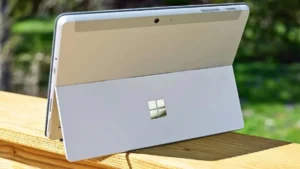 Microsoft Surface PC tablet-laptop hybrid shown from rear with built-in kickstand open outdoors