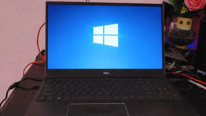 Dell laptop displaying Windows logo screen used to illustrate Microsoft warns new Windows update issue