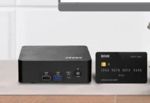 MSI Cubi NUC AI+ 3MG Mini PC Brings 100 TOPS, Core Ultra 9, Dual 2.5GbE MSI Cubi NUC AI+ 3MG mini PC placed on desk beside bank card showing compact size