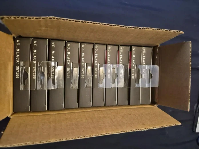 Close-up of WD Black SN7100 SSD packages stacked inside a cardboard delivery box